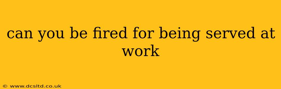 can you be fired for being served at work